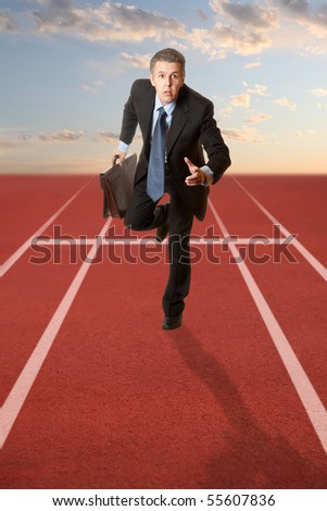 Business competition. Businessman running with a briefcase