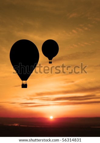 Hot air balloon with setting sun