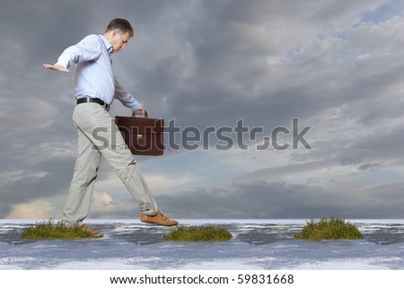 The businessman walks on a bog