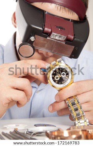 Watchmaker. Watch repair craftsman repairing watch