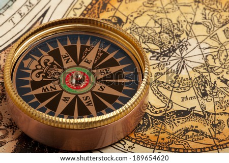 Old compass on vintage retro map