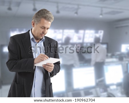 Man journalist writing letter on the notepad