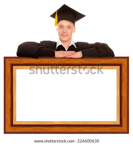 Happy college graduate standing behind frame isolated on white background