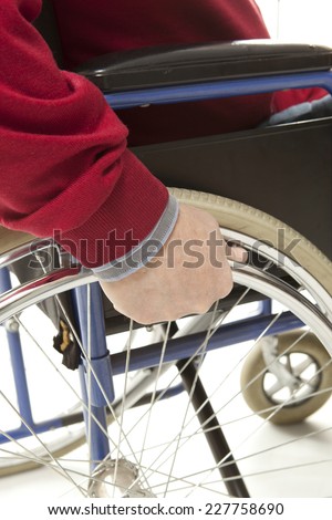 Wheelchair user makes various movements with his wheelchair, exercises for safety handling