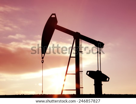 Oil pump oil rig energy industrial machine for petroleum in the sunset background