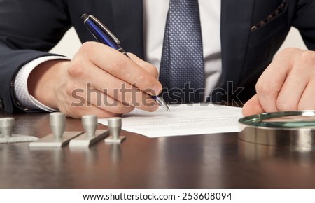 Lawyer, notary signs the documents from our office