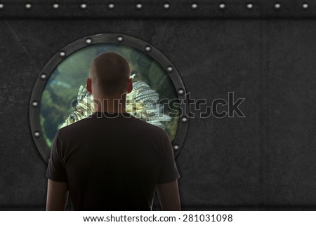 Captain looks out the window of the submarine