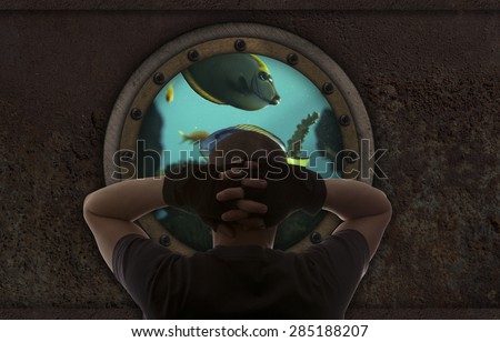 Captain looks out the window of the submarine