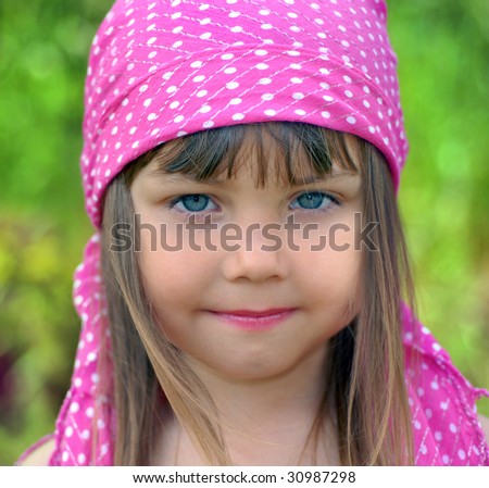 stock photo Little model with shawl on her head