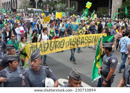 Sao Paulo, Brazil - November 15. Protesters marching on Paulista Avenue holding signs with messages against the corruption of brazilian goverment on November 15th, 2014 in Sao Paulo, Brazil.