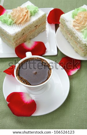 sweet breakfast : whipped cream cake with roses and hot black coffee