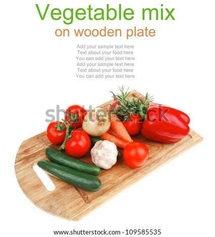 Composition with Different raw Vegetables isolated over white background on kitchen board