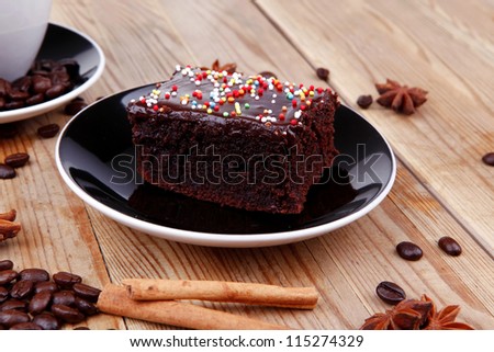 sweet food : black fragrant coffee and chocolate cake with cinnamon , coffee beans, and anise star