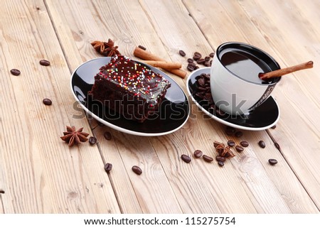 dessert : hot black coffee and chocolate cake with cinnamon , coffee beans, and anise star