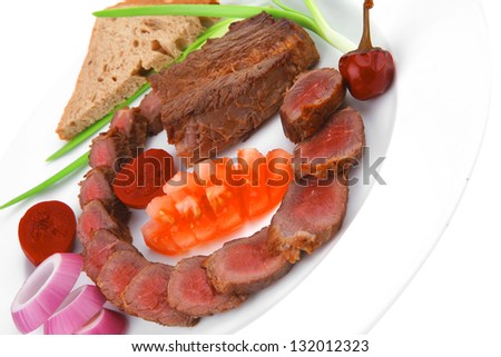 main course : roast red meat slices served on white plate with tomatoes , sprouts and bread  isolated on white background
