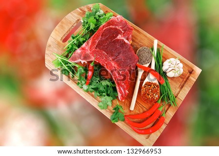 uncooked meat : raw fresh beef pork rib ready to cooking with garlic and red hot pepper over wood isolated over white background