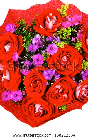 flowers : big bouquet of rose and pansy flowers with green grass in red wrapping paper isolated over white background