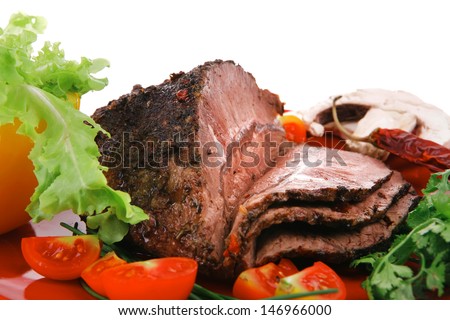 beef slice on red plate and vegetables