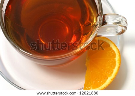 hot tea inside transparent glass and lemon slice