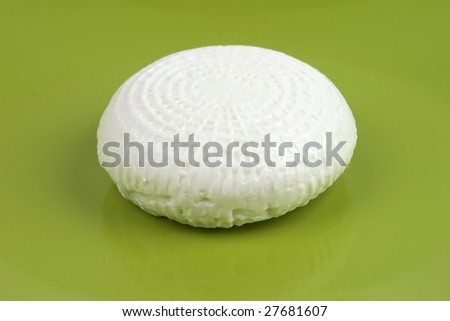 white goat cheese on green dish