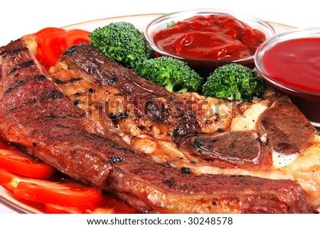 roast juicy fat steak and red hot sauces