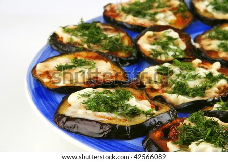 served grilled egg plant on blue plate