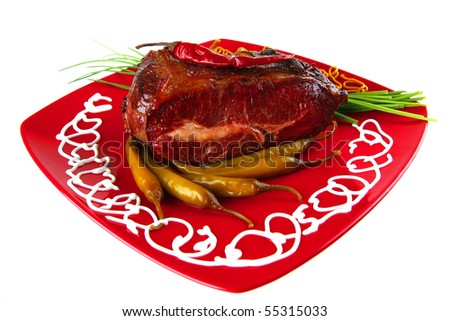 main meat course on red plate with vegetables