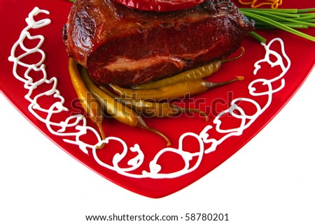 beef meat and vegetables on red plate