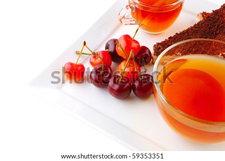 black english tea and cakes with red cherry
