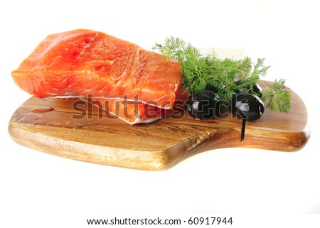 smoked fresh salmon piece with olives and white cheese