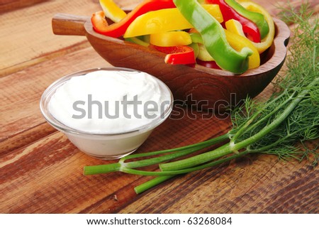 peppers and sour cream over wooden tables