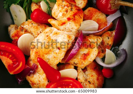 chicken with tomatoes and hot peppers on pan
