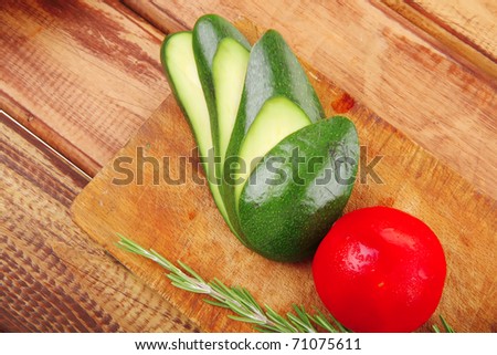 raw vegetables served on wood cutting board