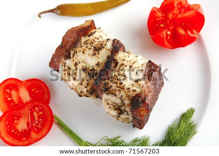 roast beef steak with melted cheese over white