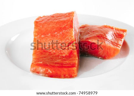 smoked fresh salmon piece on a big white dish