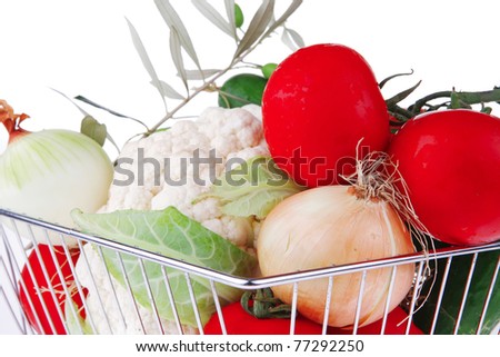 market basket filled with vegetables on white