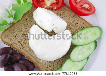 low fat mozzarella on white with tomatoes and olives