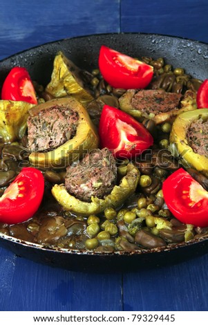 homemade cuisine: zucchini filled meat on peas and beans cooked into pan
