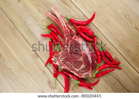 fresh meat : raw beef spare ribs red with chili pepper over wooden board