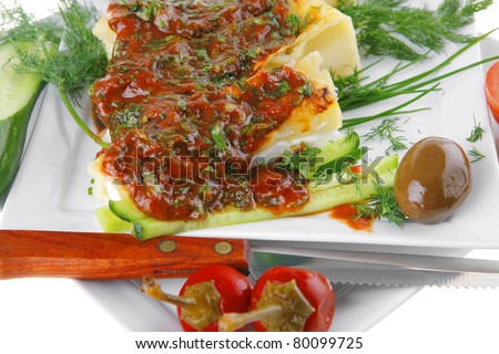 cheese cannelloni served with vegetables on square plate