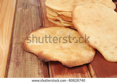 big hot baked cakes served on wooden plate