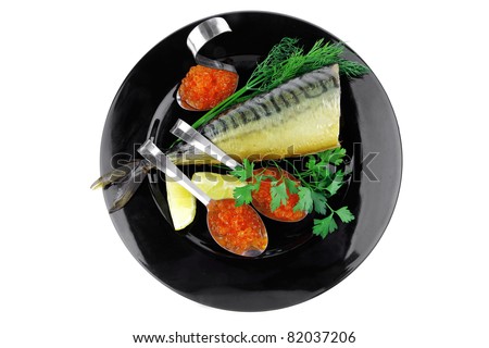 smoked fish with red caviar on black plate