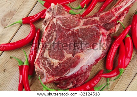 fresh raw meat : fresh red beef ribs with red chili pepper over wooden board