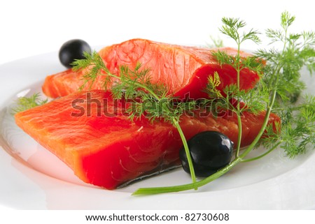 smoked fresh salmon piece with olives and fennel