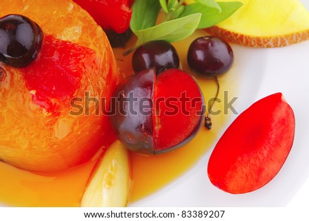 fruit ice cream with fruits on big white plate