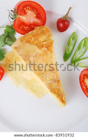 food : cheese casserole piece on white plate served with parsley and tomatoes isolated over white background
