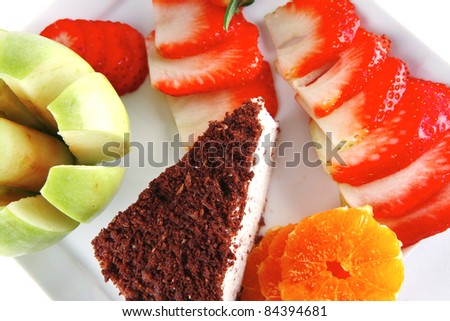cream cake, raw apple, and strawberry on plate