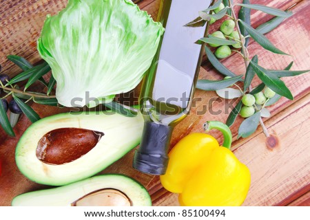 vegetables prepared for use on wooden table with oil