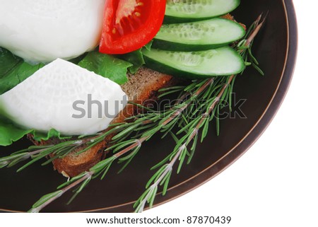 mozzarella cheese with olives and bread on dish