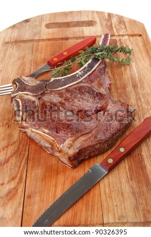 meat food : grilled beef spare rib on wooden plate with thyme